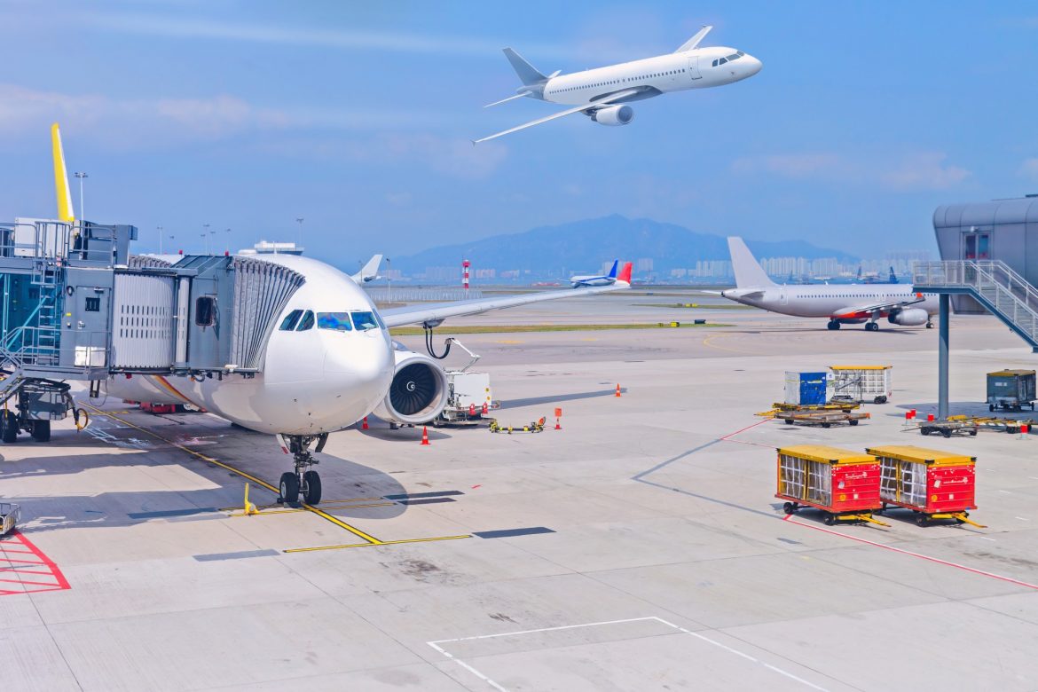 airport-boarding-bridge-for-a-passenger-plane-view-at-the-parking-lot-of-hong-kong-airport_t20_znJnBx